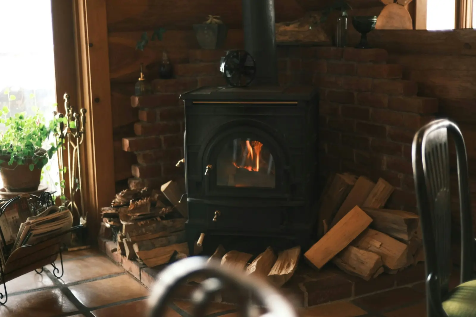 Wood-burning stove on a brick hearth in a living room